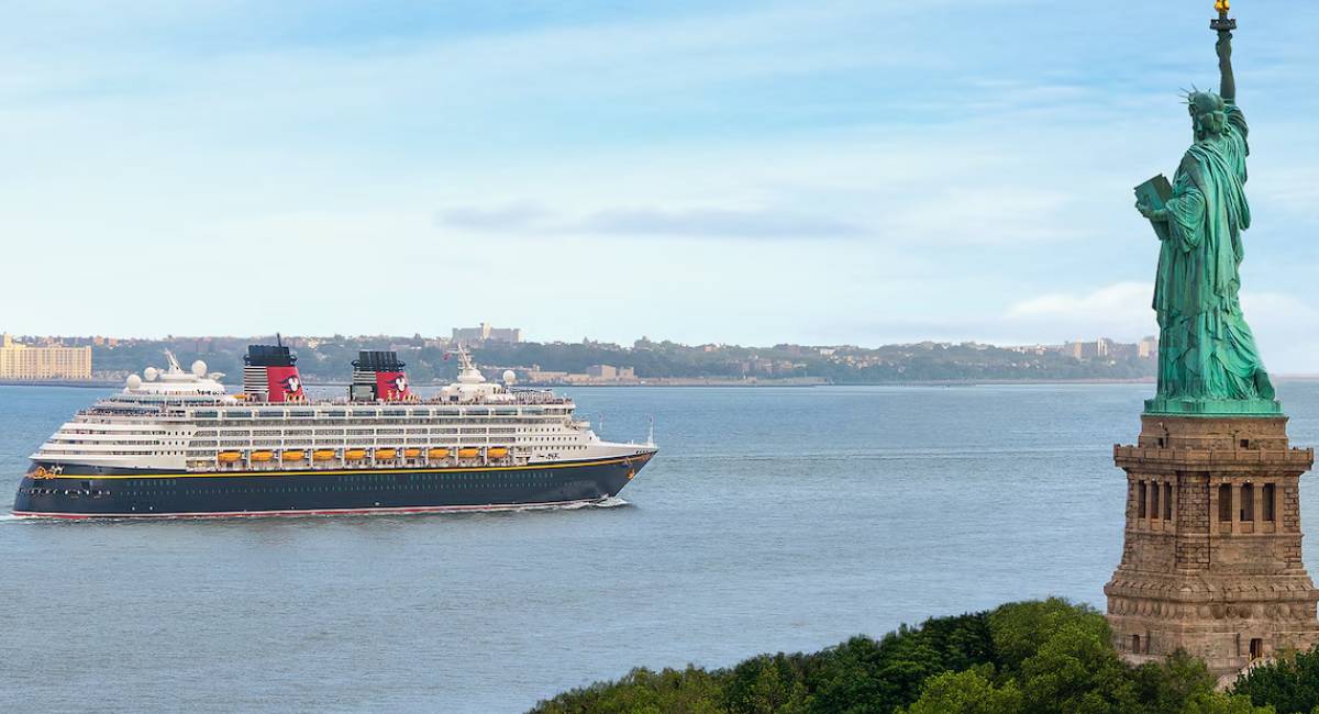 Disney Cruise Line ship sailing past the New York City skyline