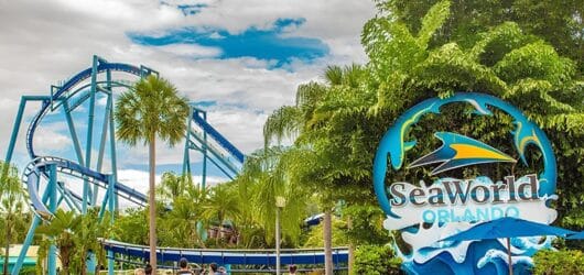SeaWorld Orlando entrance sign with Mako roller coaster in the background