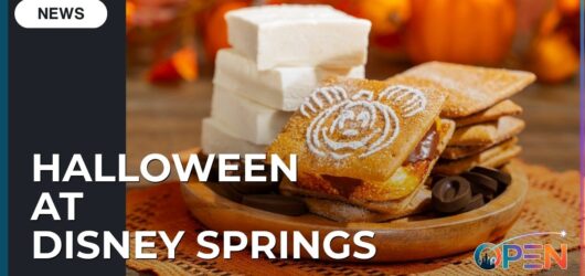 Ultimate Foodie Guide to Halloween at Disney Springs 2026 9 A Disney Springs Halloween news graphic featuring a gourmet Pumpkin Spice S’more stamped with a powdered-sugar Mickey pumpkin design.
