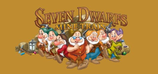 Official Seven Dwarfs Mine Train logo featuring all seven dwarfs standing together in front of a rustic background.