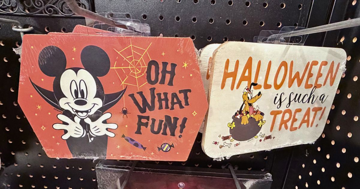 Disney Mickey Mouse and Pluto Halloween wooden wall art on display shelves
