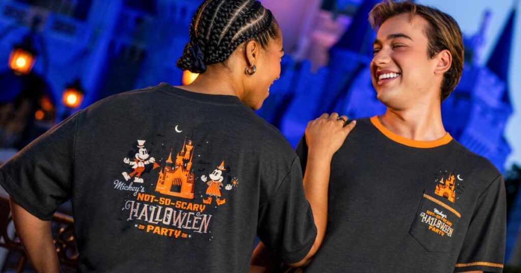 Mickey's Not-So-Scary Halloween Party 2026 1 Guests wearing official 2026 Mickey's Not-So-Scary Halloween Party short-sleeve shirts showing front pocket and back artwork.