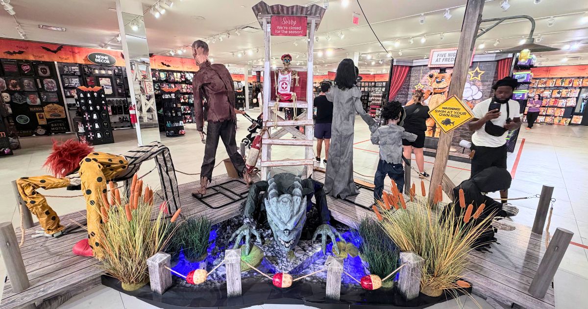 Spirit Halloween Camp Monsters themed animatronic display environment inside Kissimmee store