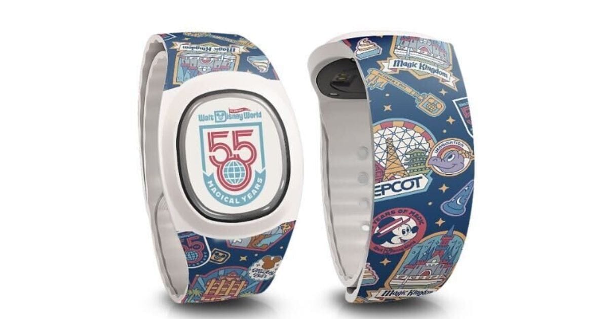 Front and back views of the Walt Disney World 55th Anniversary MagicBand+ with a white puck reading 55 Magical Years and a navy strap covered in retro Magic Kingdom, EPCOT, and Figment badges