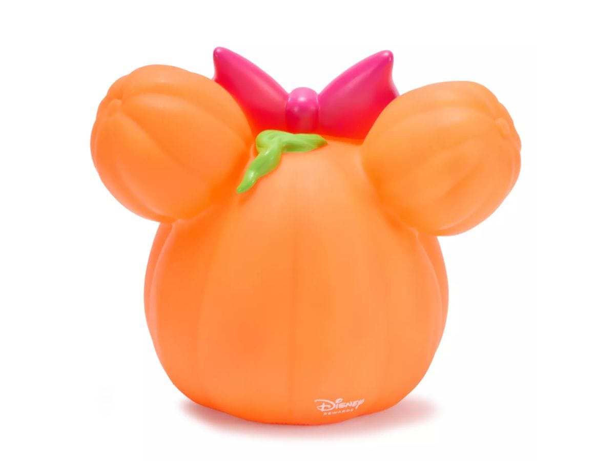 Back view of the 2026 Minnie Mouse Jack-o-Lantern showing the green stem and Disney Rewards logo on the base.