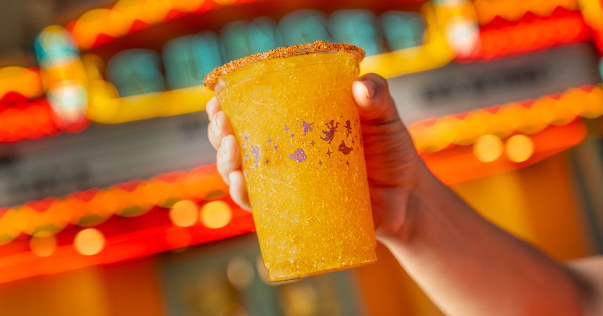 Vibrant tropical frozen slush beverage finished with a sweet and spicy chili-seasoned rim, served near Sunset Boulevard