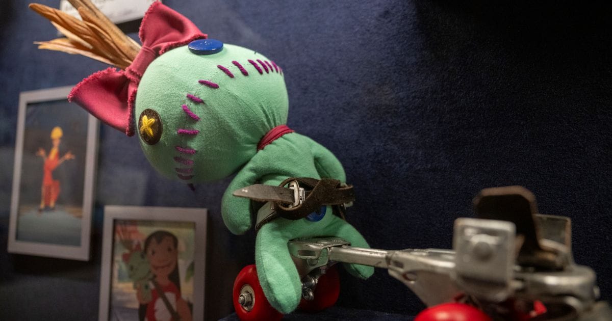 Prop of Lilo's ragdoll Scrump strapped onto a metal roller skate from Lilo and Stitch