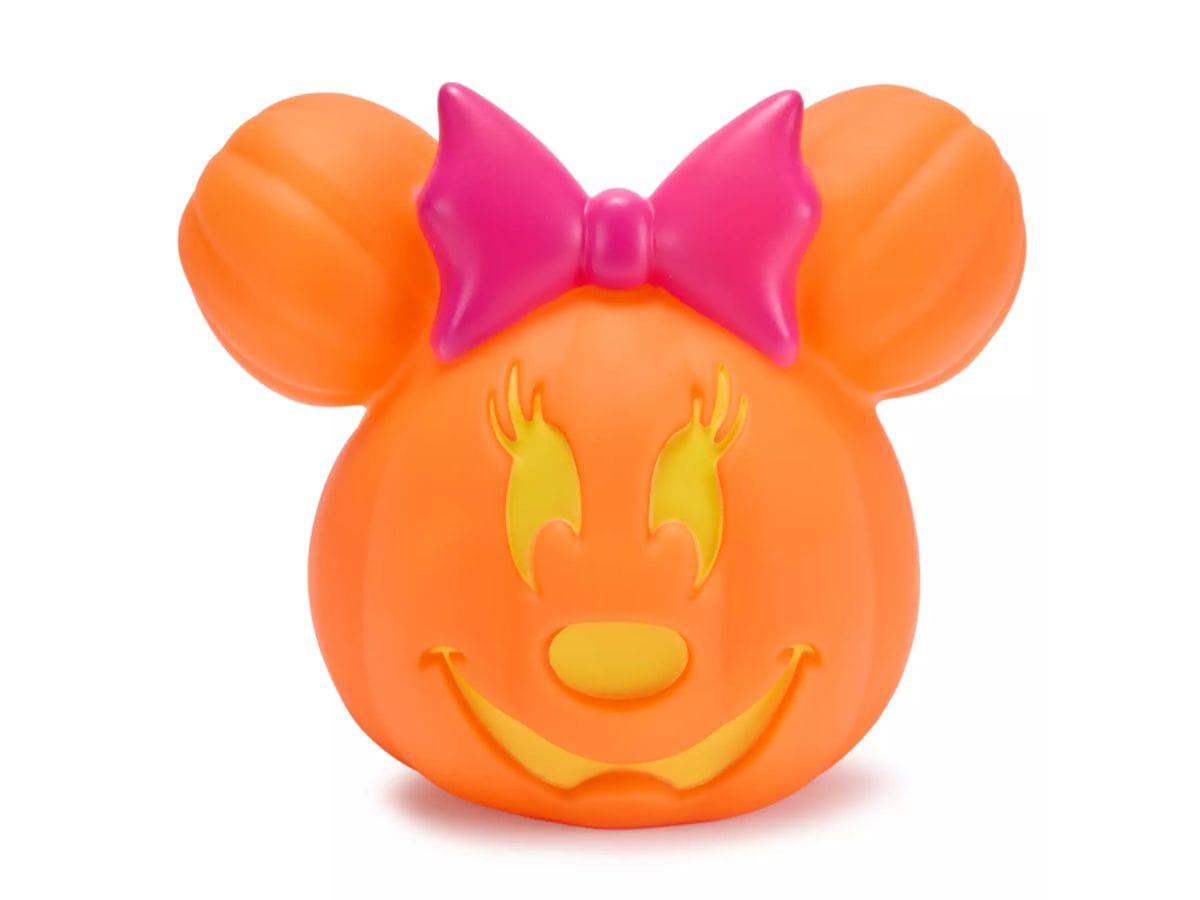 Front view of the unlit orange Minnie Mouse Jack-o-Lantern with a pink bow, a 2026 Disney Rewards exclusive.