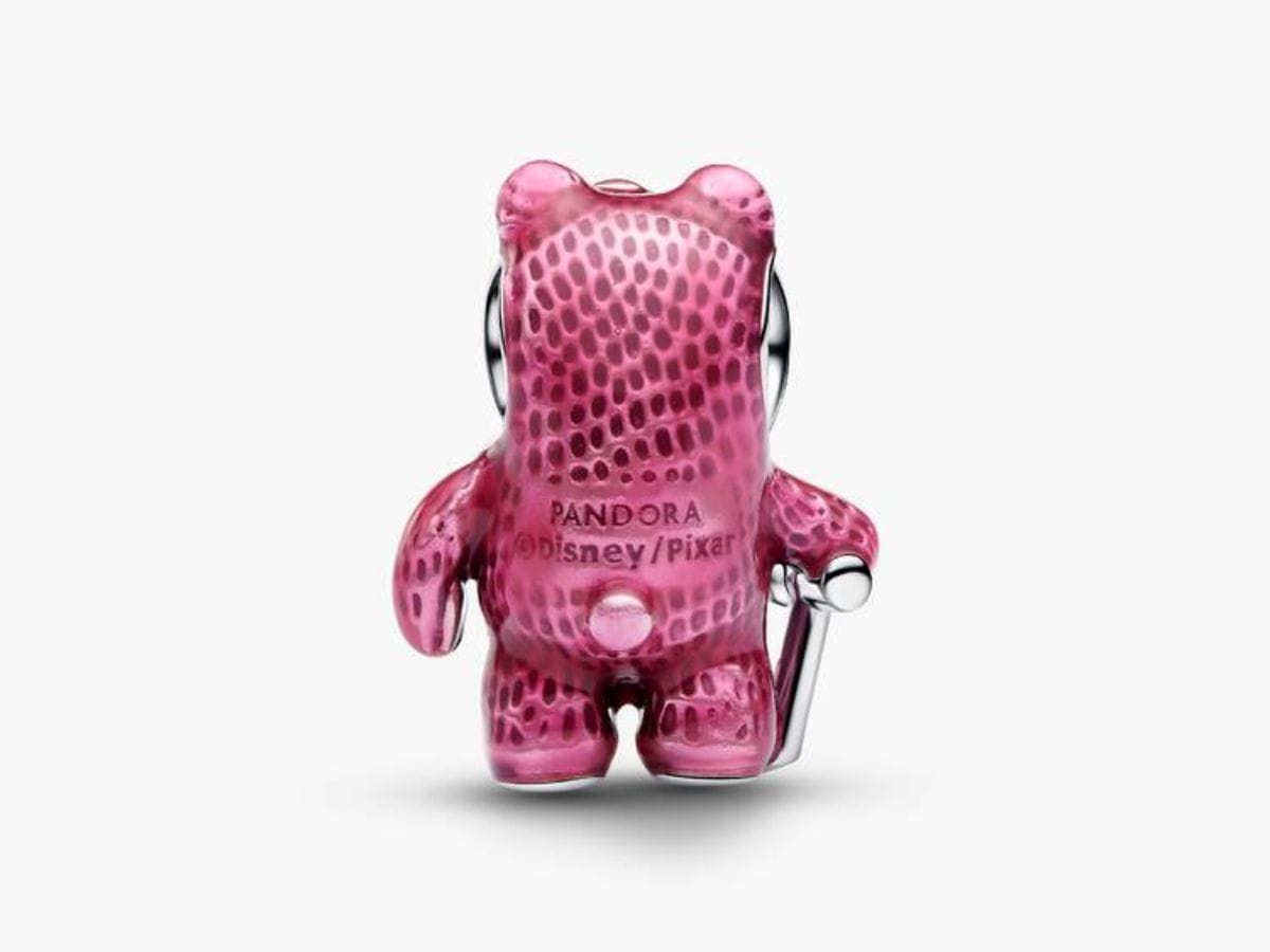 Back view of the Pandora Lotso Bear charm showing textured pink enamel and official Pandora and Disney Pixar hallmark engravings.