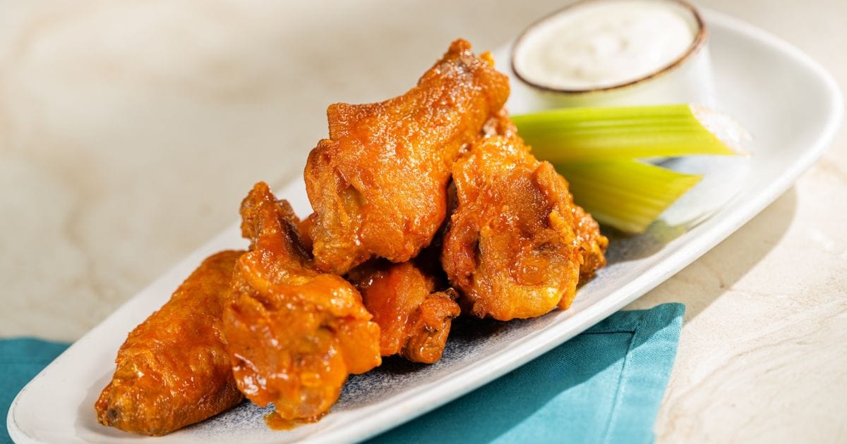 Crispy chicken wings with celery and blue cheese at The Turf Club Bar and Grill
