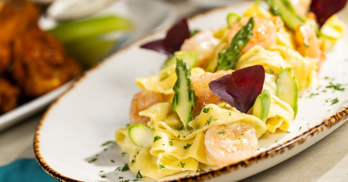 Pappardelle Shrimp Pasta with shrimp and asparagus at The Turf Club Bar and Grill