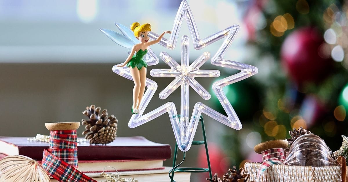 Tinker Bell light-up Christmas tree topper featuring a sculpted Tinker Bell in a green dress resting against an illuminated star.