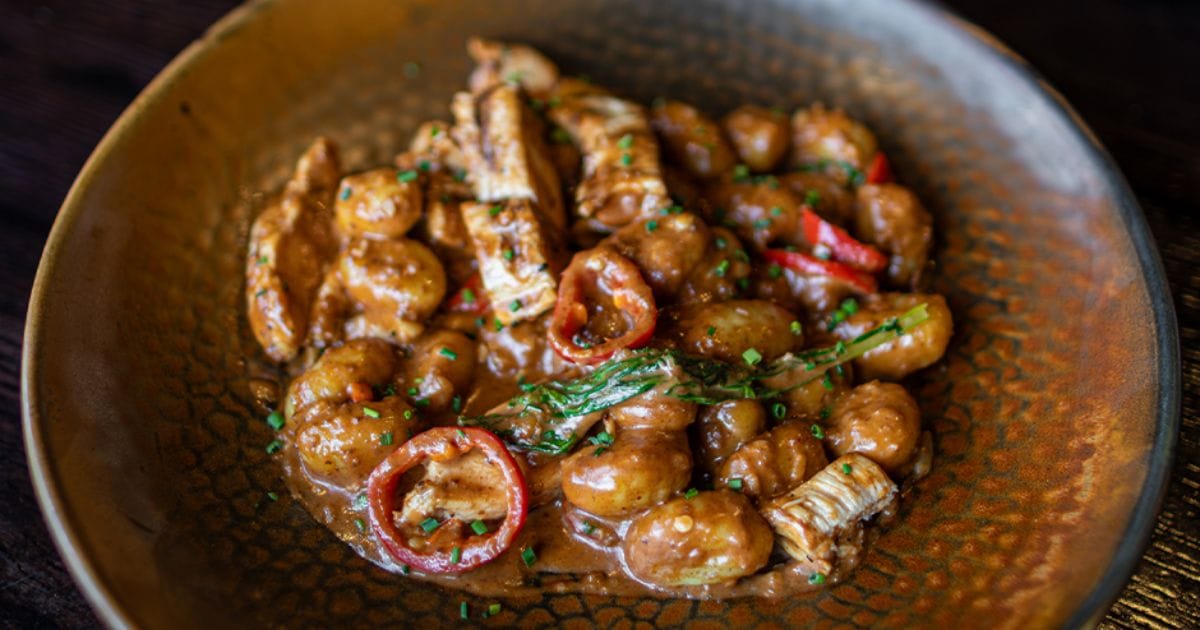 Anniversary Gnocchi at Toothsome Chocolate Emporium tossed with grilled chicken and mole cream sauce