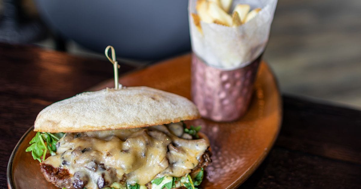 Grilled Steak Sandwich at Toothsome Chocolate Emporium on a French baguette with caramelized onions
