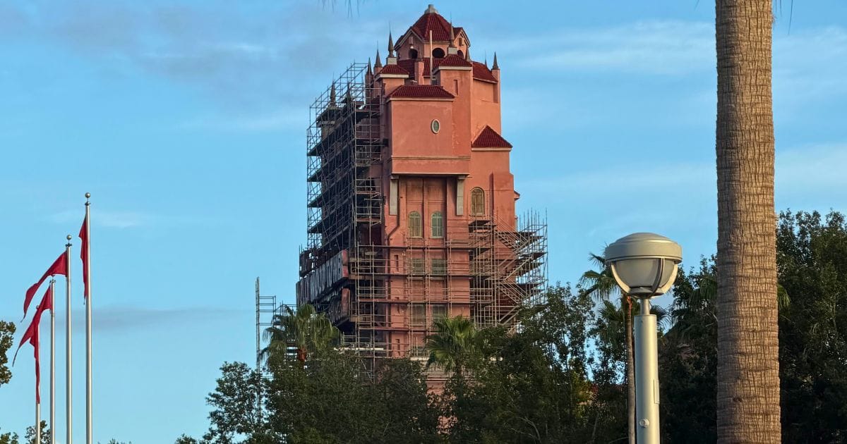 Tower of Terror Scaffolding Expands: Disney World Construction Updates 2 A close-up view of the Tower of Terror at Disney's Hollywood Studios in Orlando, Florida, showing extensive scaffolding around the iconic Art Deco-style attraction during construction.
