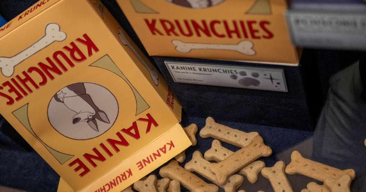 Vintage Kanine Krunchies dog biscuit boxes and bone-shaped treats on display from 101 Dalmatians