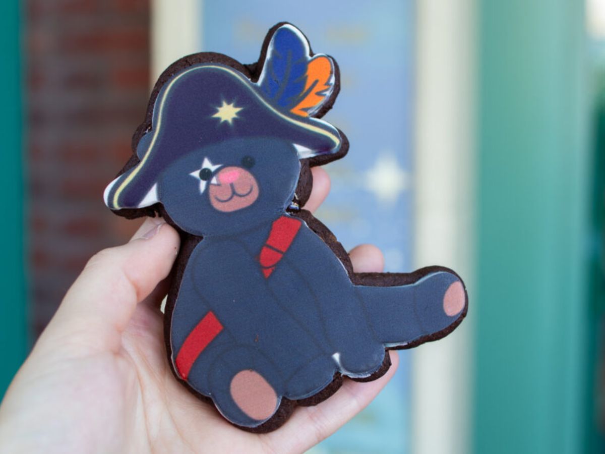 A chocolate sugar cookie shaped like Captain Cacao