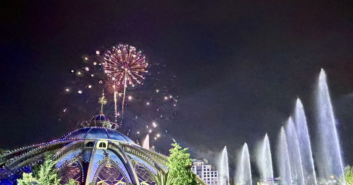 Fireworks erupting over Celestial Park with illuminated fountains during the Epic Universe after-hours event.
