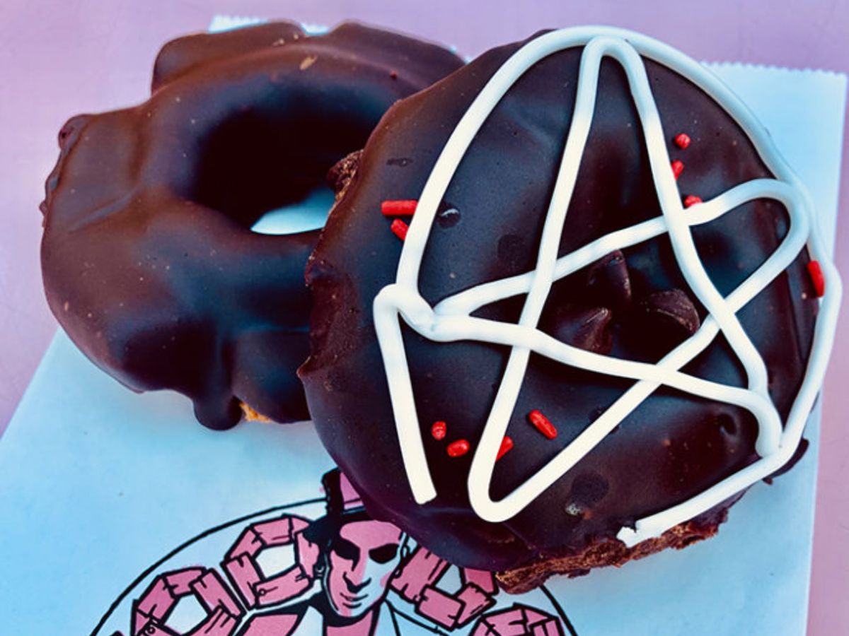 A chocolate frosted doughnut and the Diablos Rex doughnut from Voodoo Doughnut