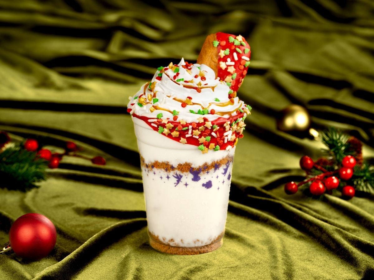 Cookie Butter Milkshake served in a clear cup with whipped cream