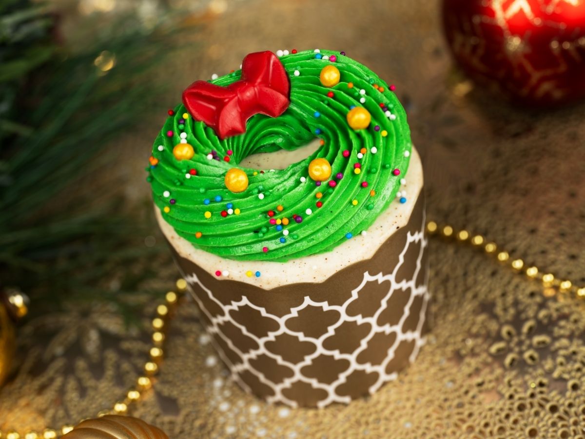 The Coquito Wreath Cupcake topped with green frosting at Rosie's All-American Cafe