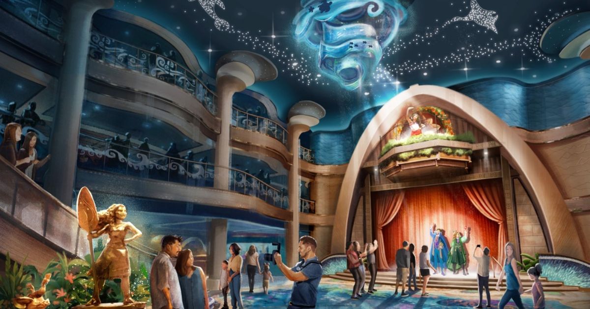 The Moana-inspired Grand Hall on the Disney Believe with an ocean-themed chandelier and bronze statues