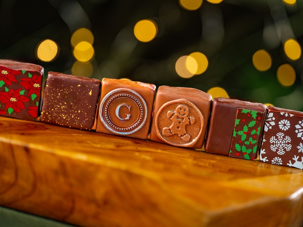The Disney Holiday Ganache Box filled with specialty chocolate squares