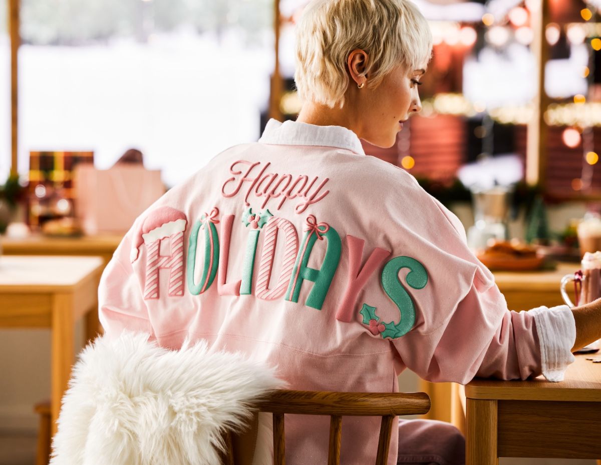 A person wearing the Disney Holiday Pastel Collection spirit jersey