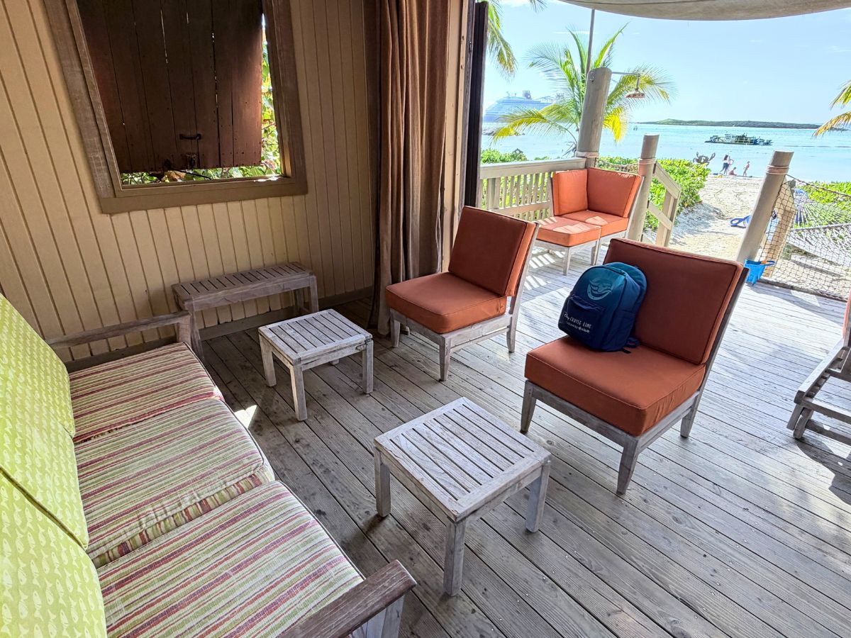 Stocked snack basket, fruit bowl, and sunscreen bottles on the cabana counter