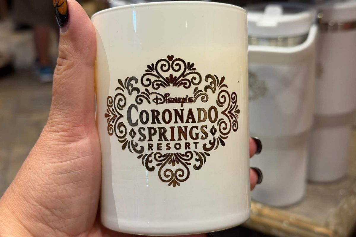 A boxed resort candle featuring the Coronado Springs branding