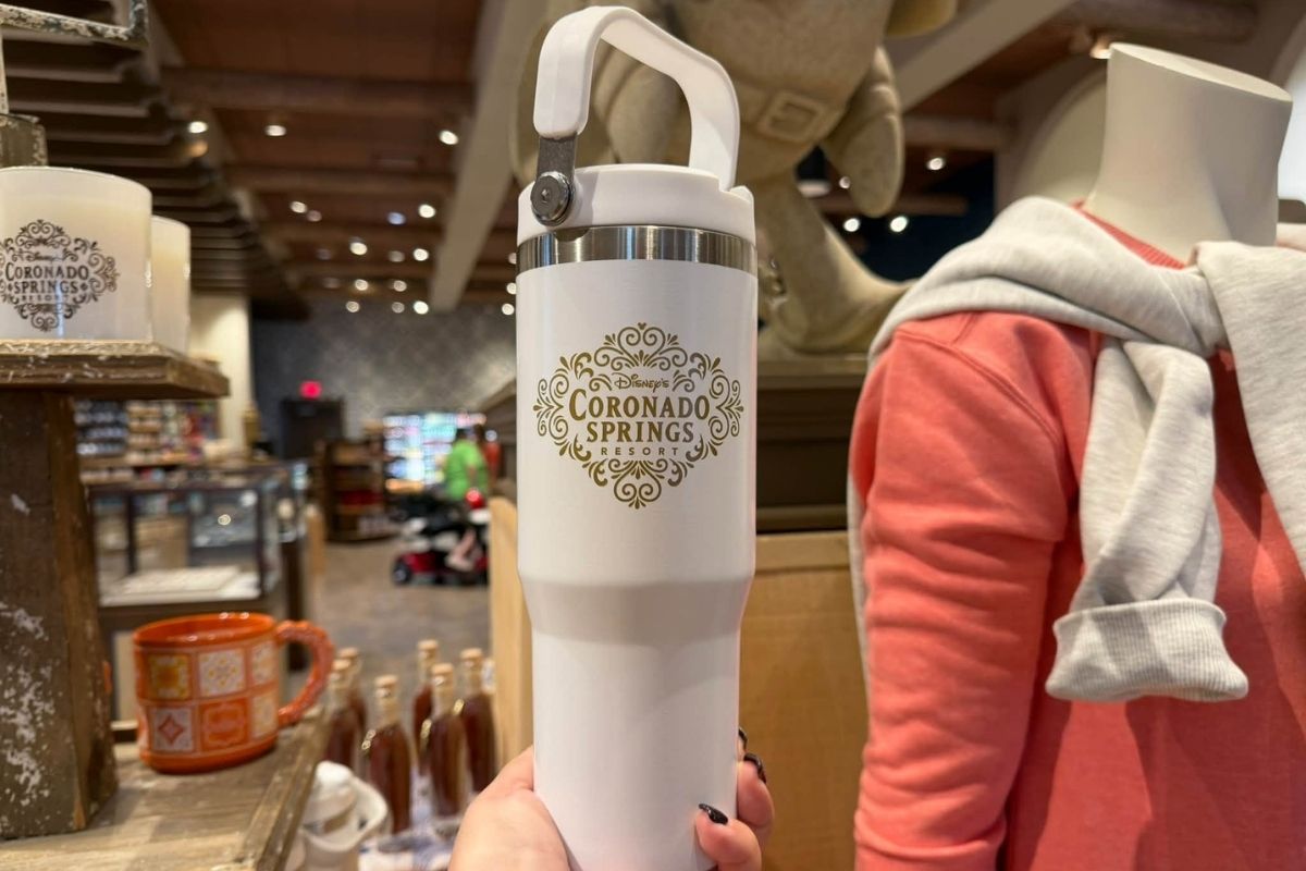Sleek white travel tumbler with the Coronado Springs logo printed in gold