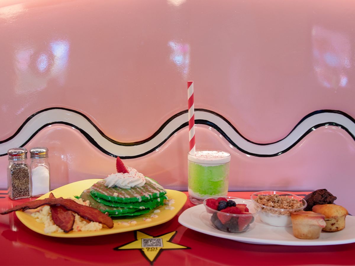 A plated breakfast featuring green themed food and eggs