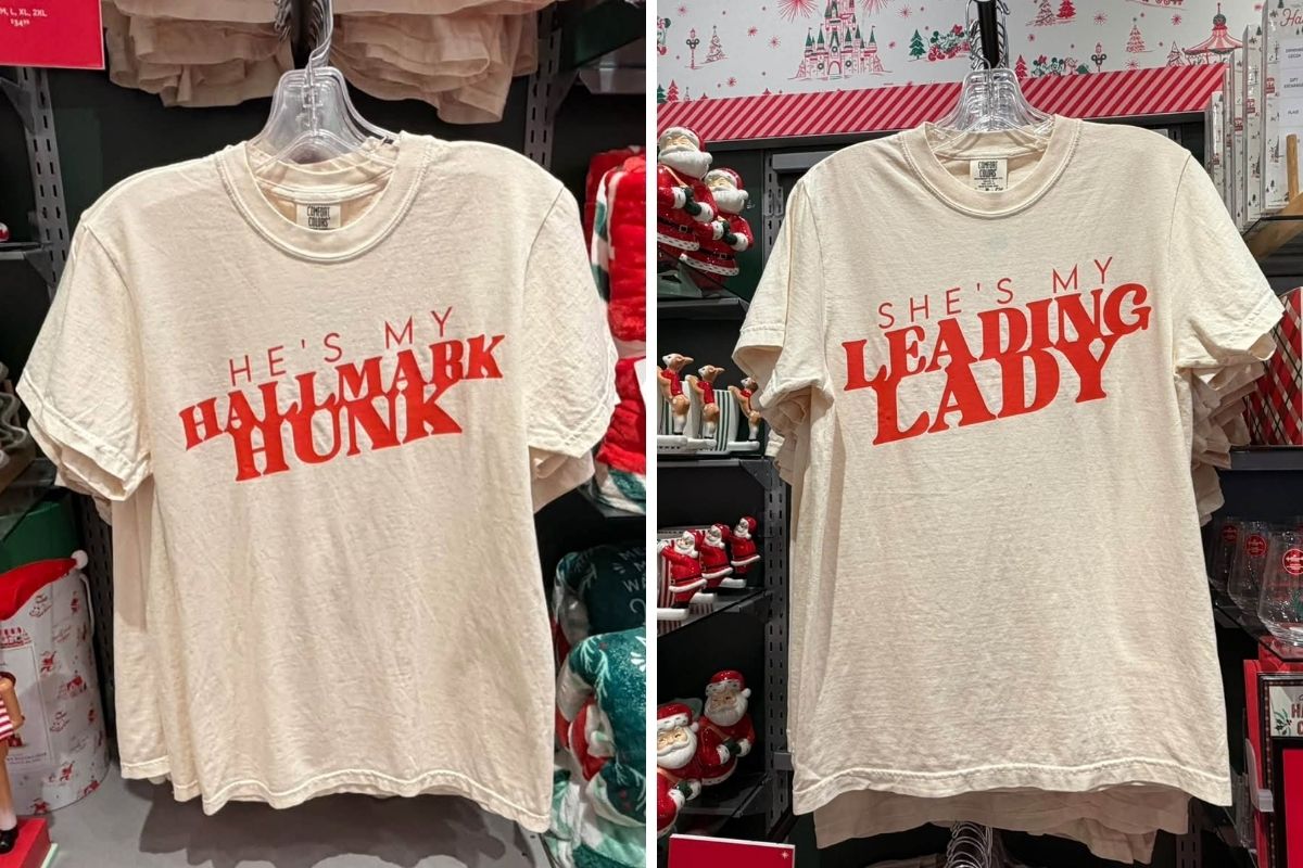 Hallmark Hunk and Leading Lady novelty graphic shirts folded on a store table at Disney Springs