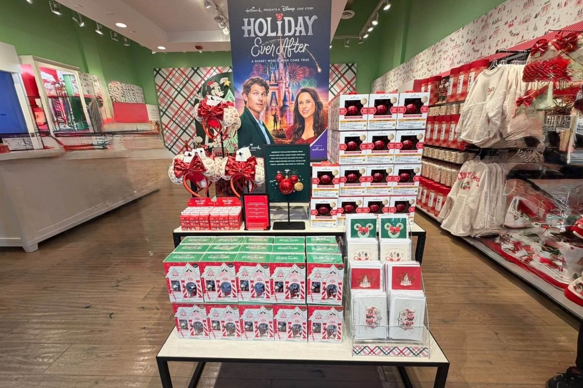 Interior merchandise display racks and holiday decor inside the Hallmark pop-up shop at Disney Springs