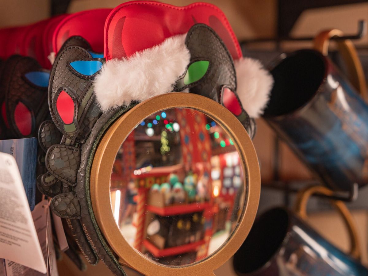 Plush Toothless Christmas ears headband wearing a Santa hat