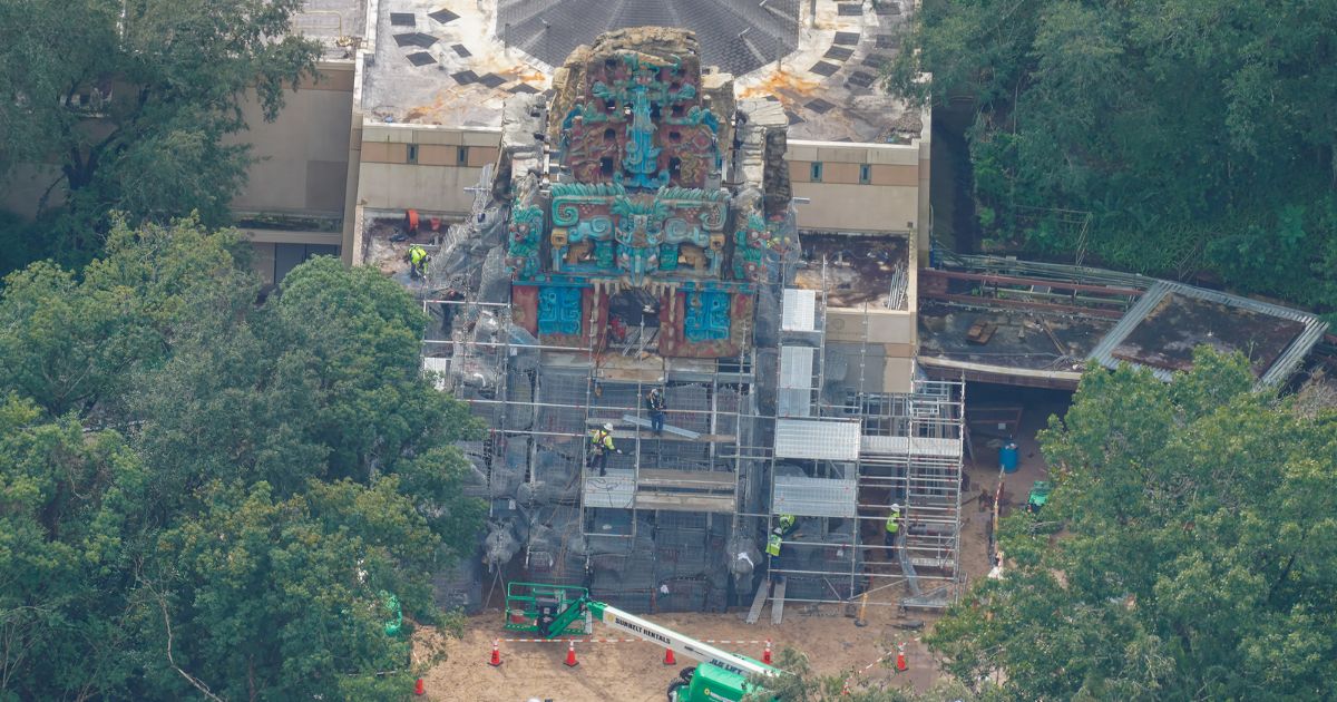 Scaffolding and painted stonework at the base of the Indiana Jones attraction