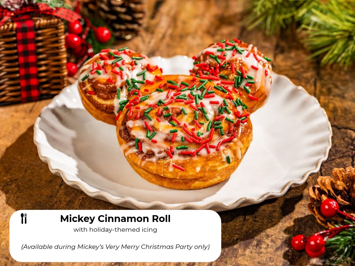 Mickey Cinnamon Roll topped with red and green holiday icing