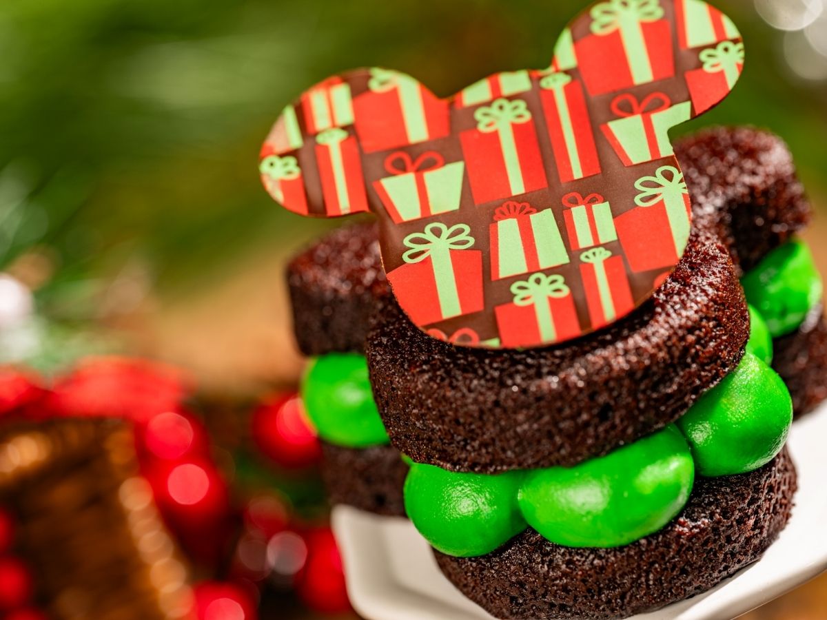A Mickey-shaped chocolate whoopie pie with a white and green peppermint center