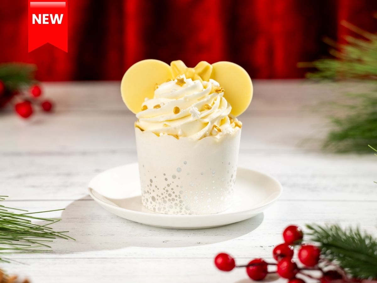 Minnie Holiday Vanilla Cupcake topped with tall green frosting and sprinkles