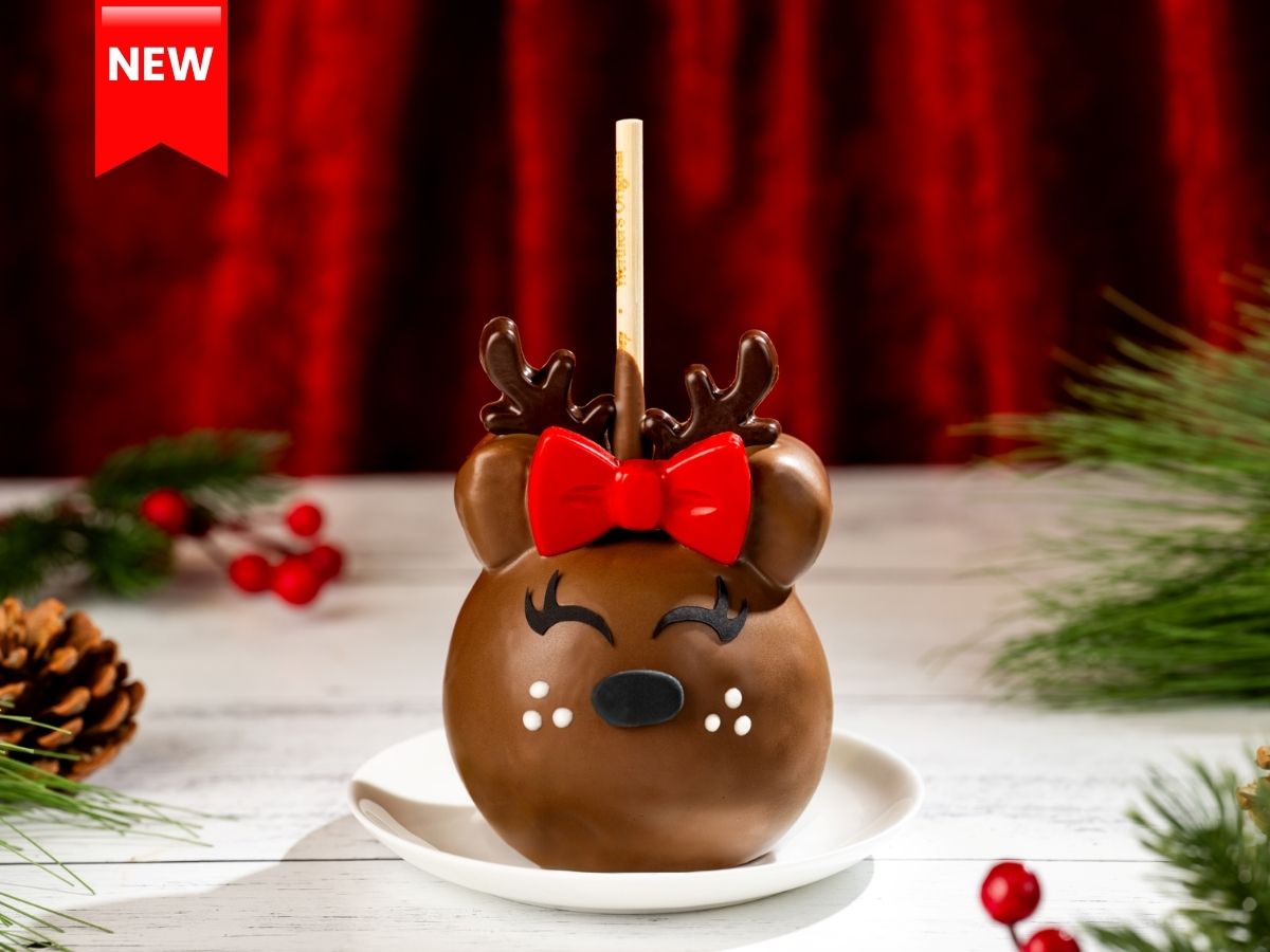 Minnie Reindeer Caramel Apple with chocolate antlers and a red bow