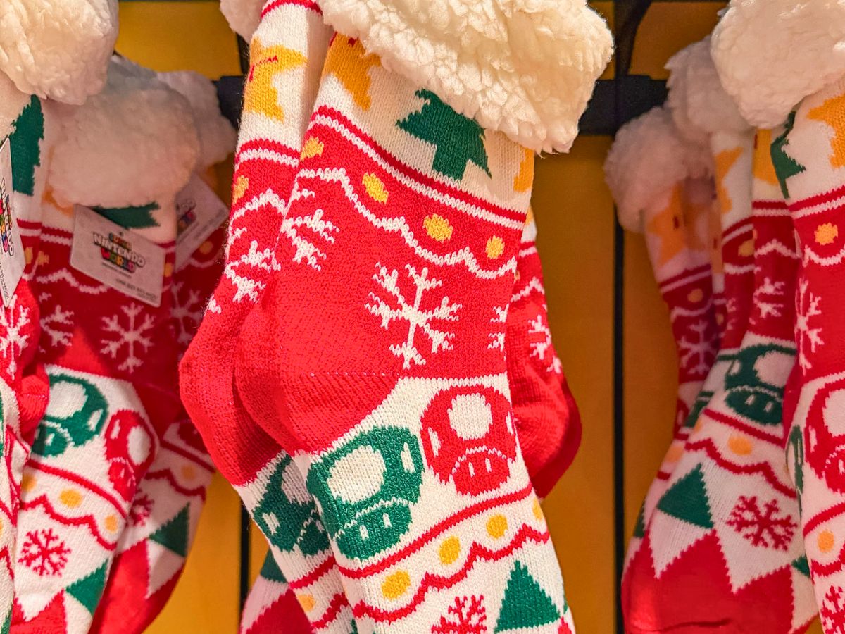 Branded Nintendo holiday stocking featuring classic 8-bit wrap-around design