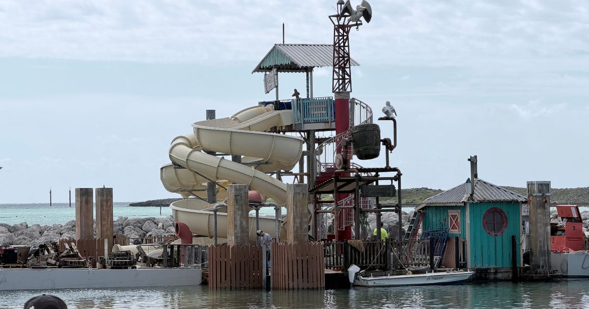 Pelican Plunge floating water slide platform shuttered offshore at Disney Castaway Cay with safety buoys