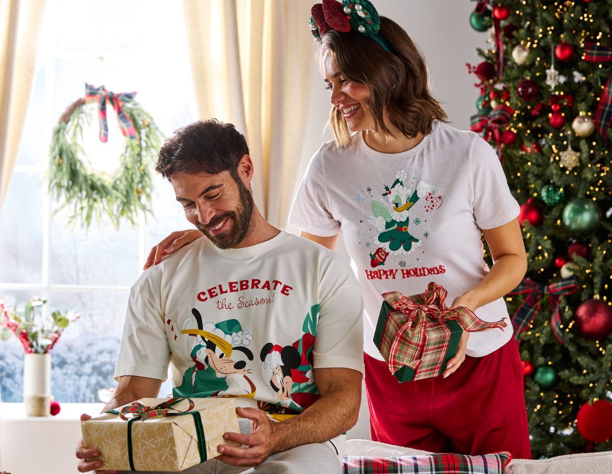 A family modeling the Santa Mickey Mouse and Minnie Mouse Plaid Holiday Sleep Sets