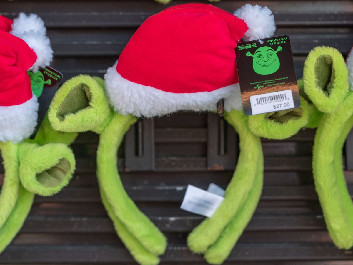 Santa Shrek headband featuring ogre horns through a Santa hat