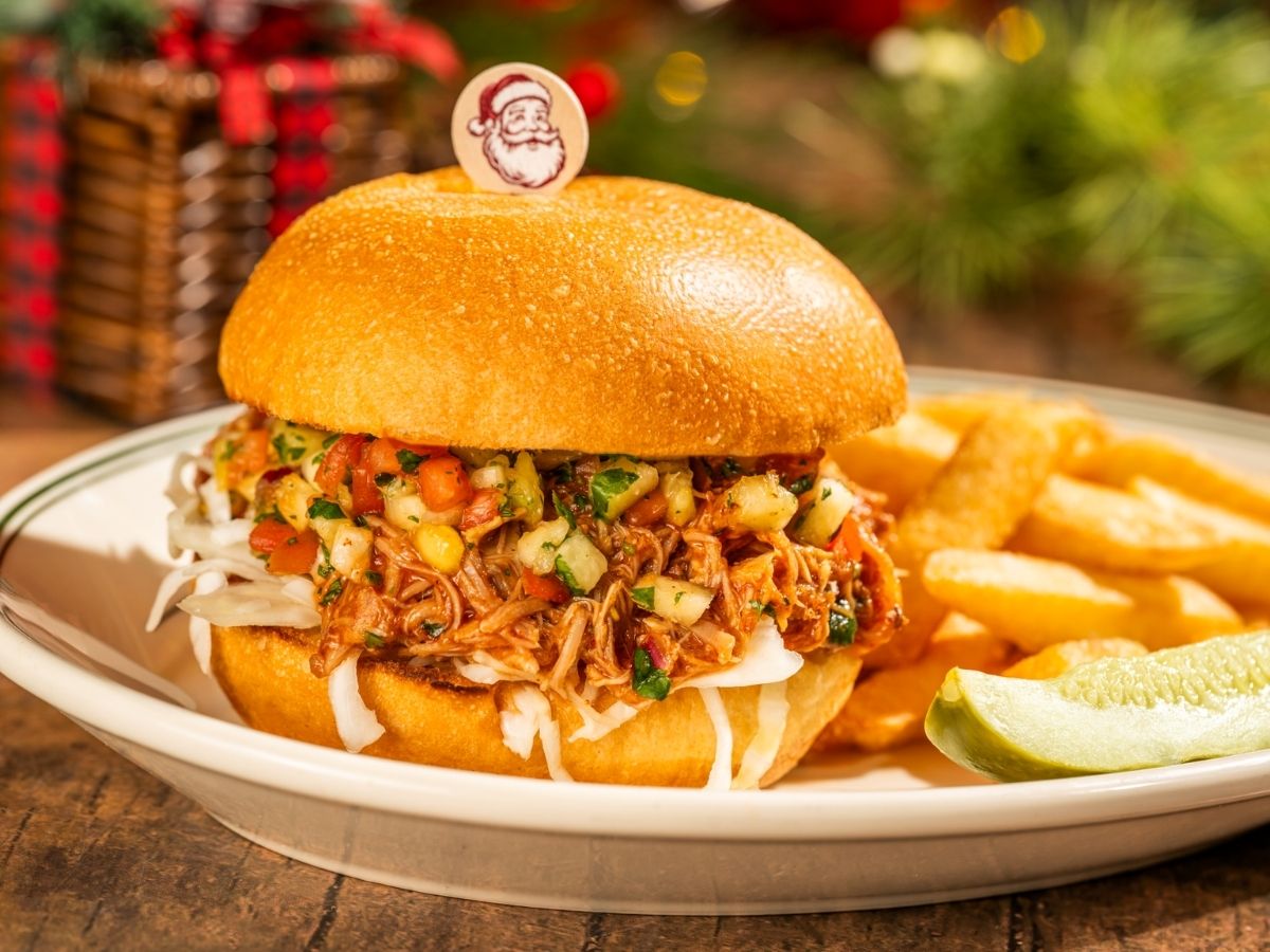 Santa's Floridian Pulled Pork Sandwich loaded with pineapple chutney on a bun