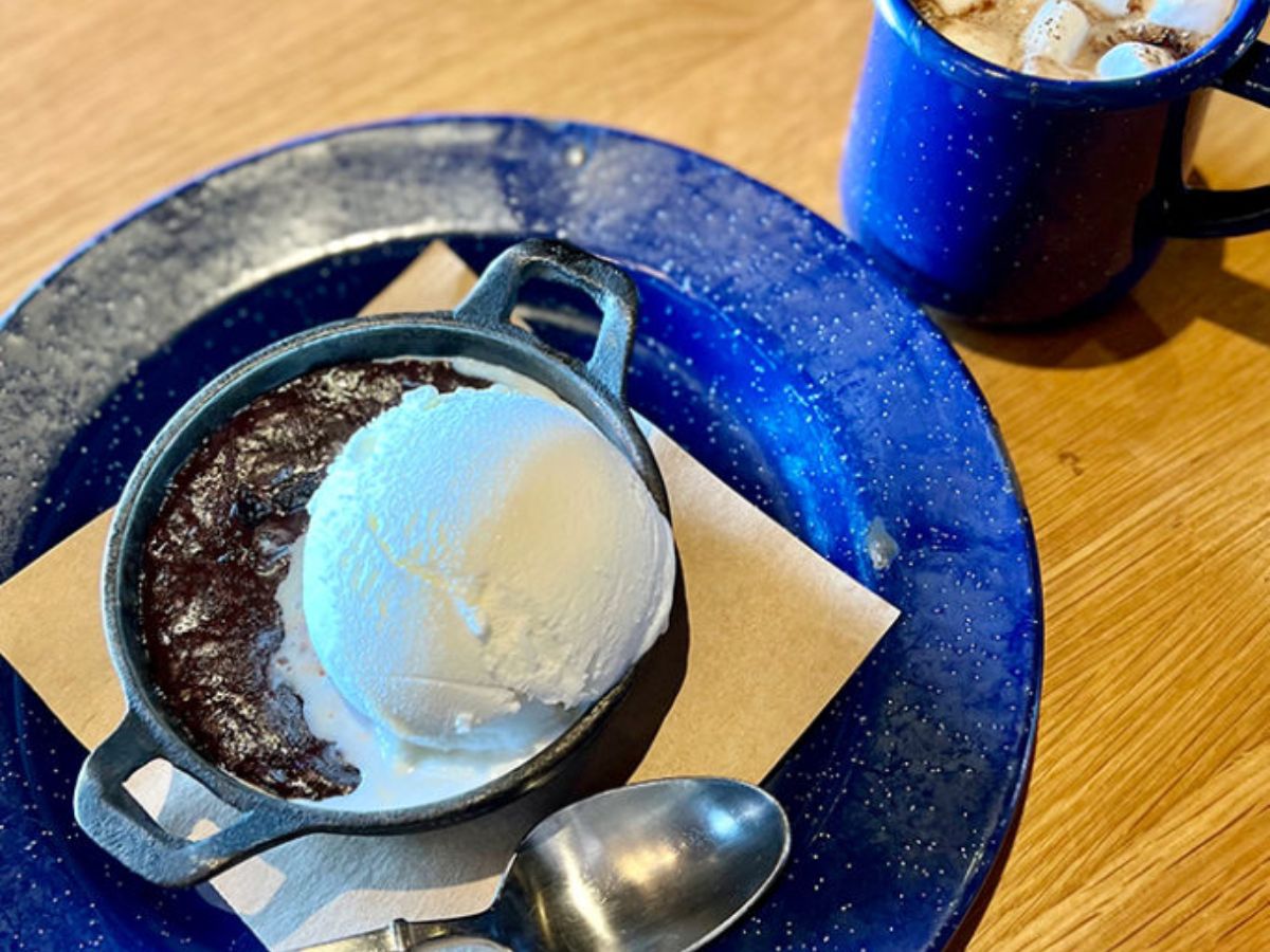 A warm skillet baked chocolate cake served with bourbon ice cream