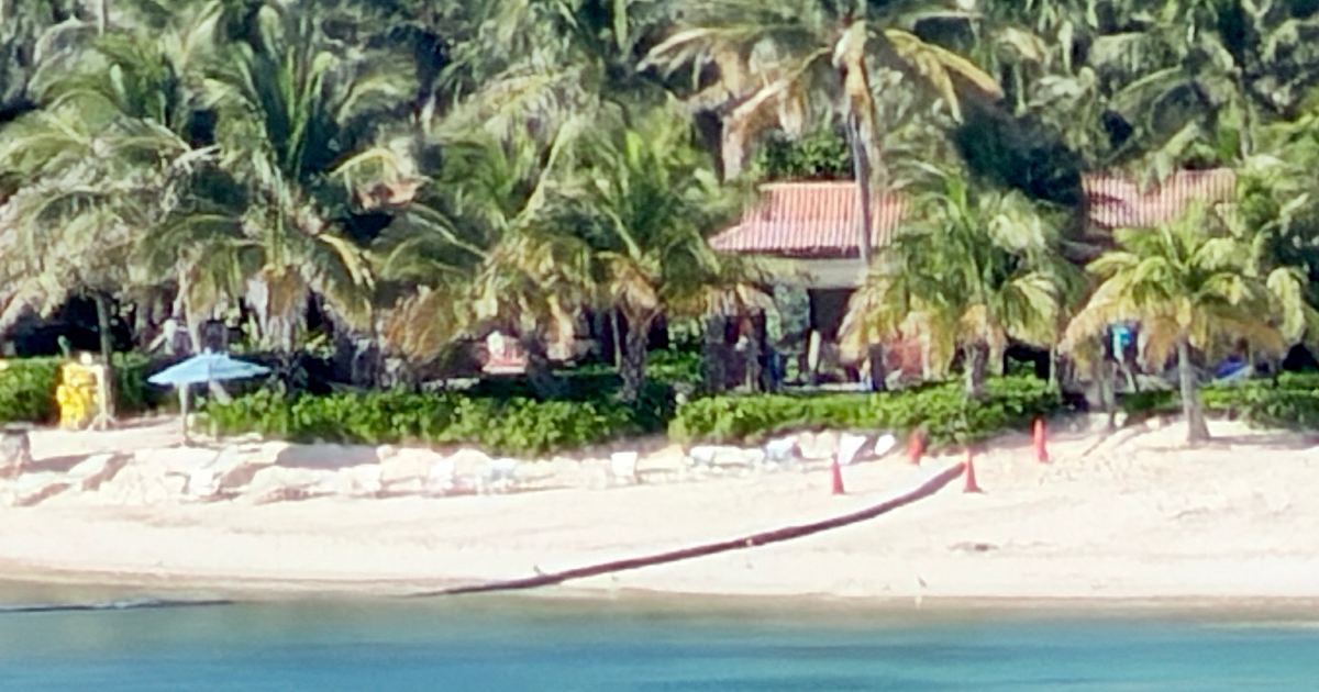 Large drainage pipe cutting through the Family Beach cabana shoreline at Castaway Cay