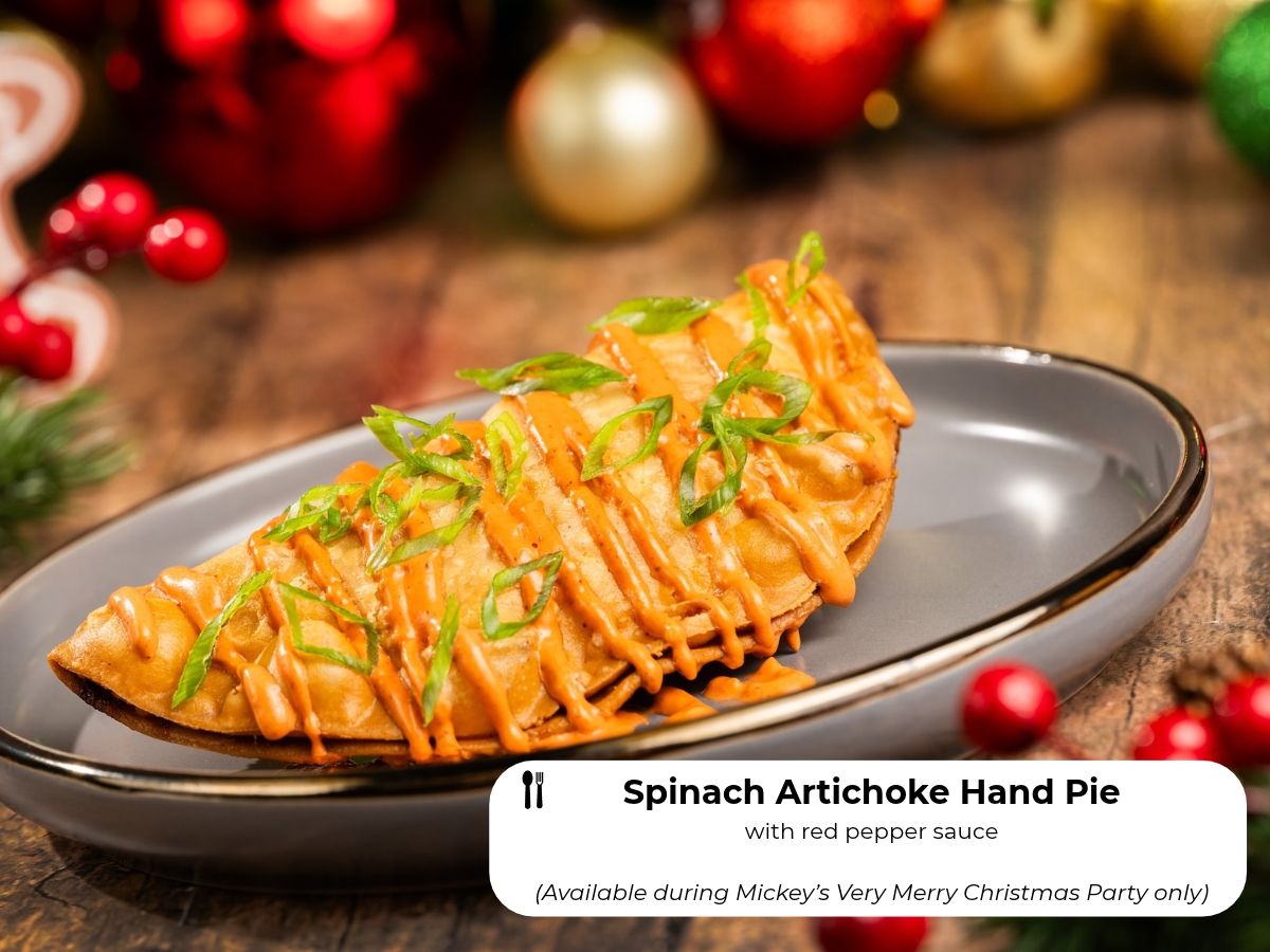 Spinach Artichoke Hand Pie with red pepper sauce