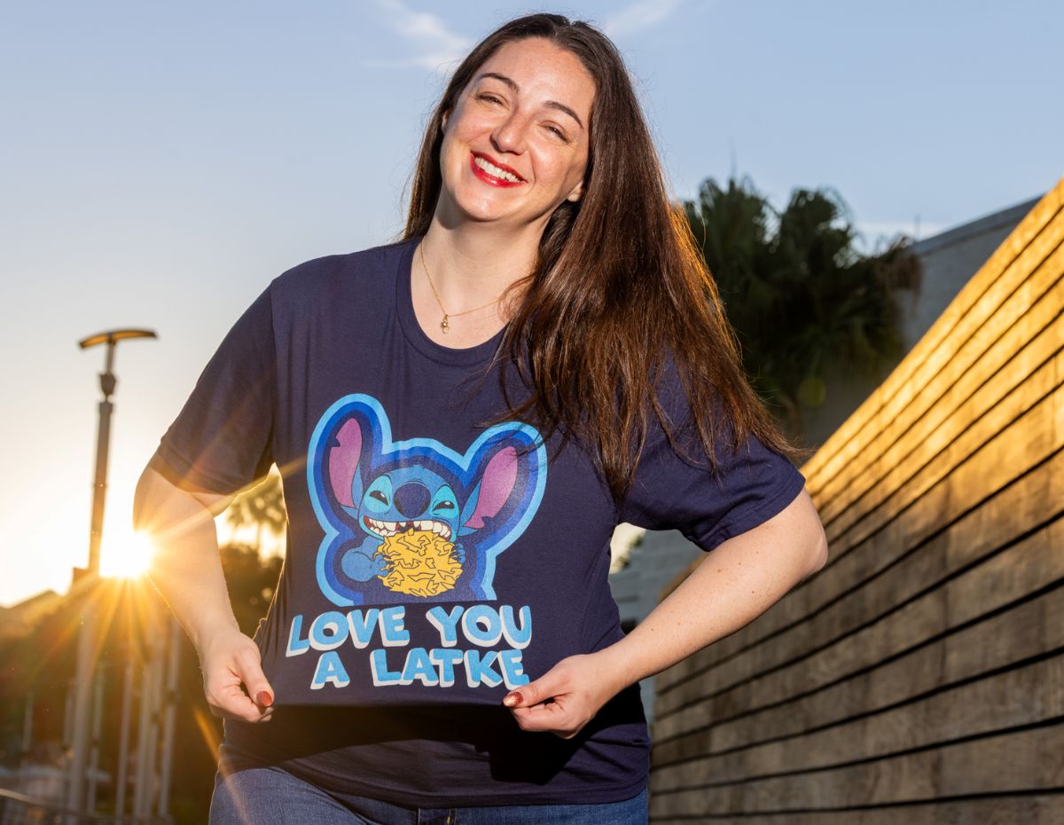 A Stitch plush holding a latke