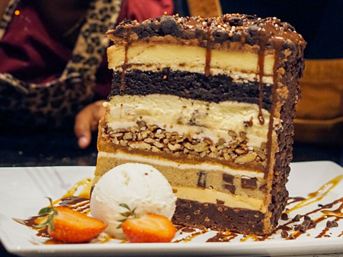A seven-layer slice of The Kitchen Sink Cake served at Hard Rock Hotel